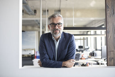 Portrait of confident businessman in office