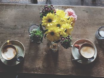 High angle view of coffee cups on table