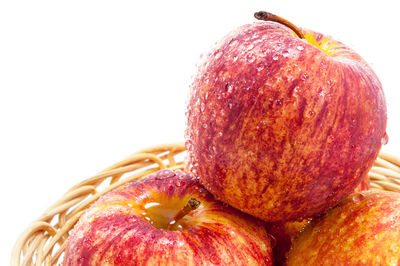 Close-up of fruit over white background