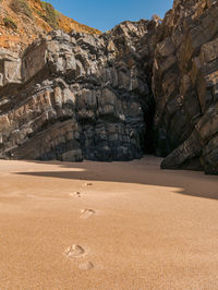 Rock formations at sandy beach