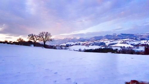 Scenic view of landscape against sky during winter