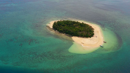 Aerial view of tropical island with a sandy beach. summer and travel vacation concept. 