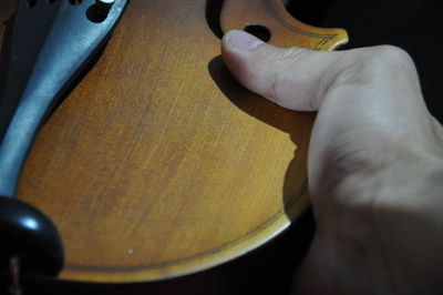 High angle view of man holding guitar