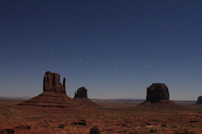 Scenic view of rock formations at monument valley against sky