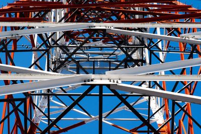 Low angle view of bridge against blue sky