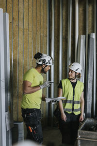 People talking at construction site