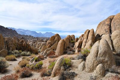 Rock formations on landscape against sky