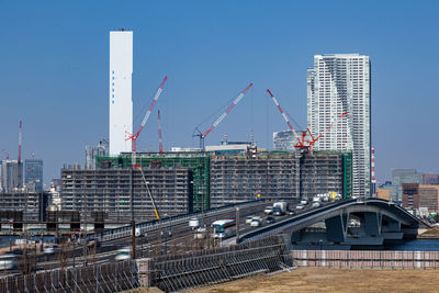 Modern buildings in city against clear sky