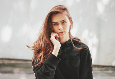 Portrait of beautiful young woman outdoors