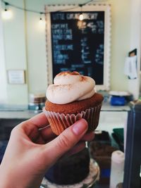 Midsection of person holding ice cream