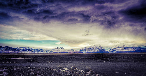 Scenic view of landscape against sky during winter