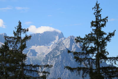 Scenic view of snow covered mountains against sky