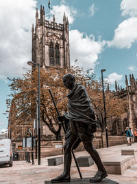 Ghandi statute in front of manchester cathedral