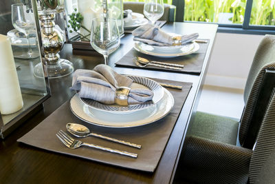 Place setting on dining table at home
