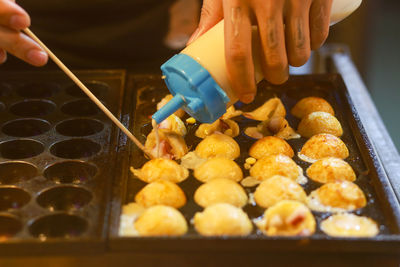 Takoyaki being prepared in ho thi ky street food, ho chi minh city