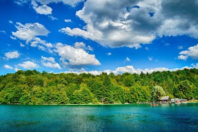 Scenic view of lake against cloudy sky