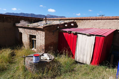 House on field against sky