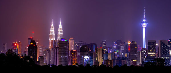 Illuminated buildings in city at night