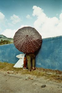 Rear view of man standing in water