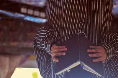 Upside down image of man reading book