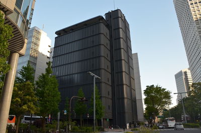 Low angle view of skyscrapers against clear sky