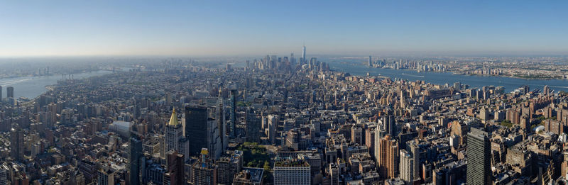 High angle view of modern buildings in city against sky