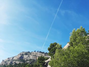 Low angle view of vapor trail against sky