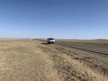 Scenic view of agricultural field against clear sky