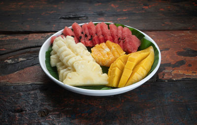 High angle view of fruits in plate on table