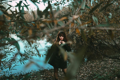 Portrait of young woman in forest