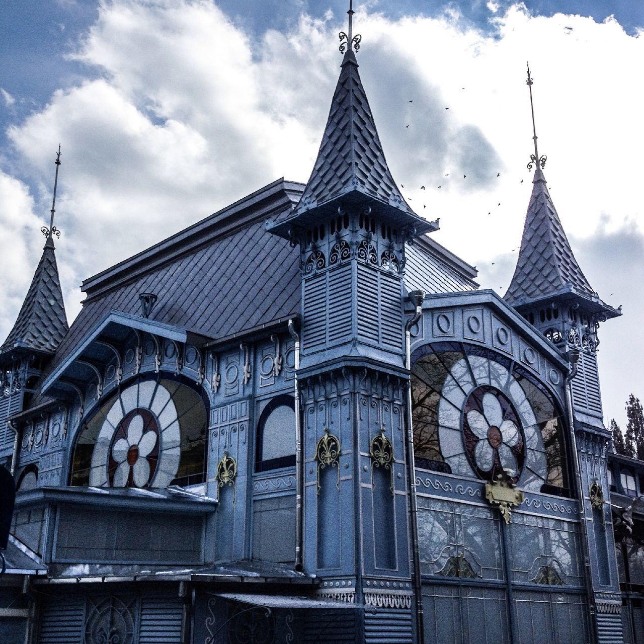 religion, place of worship, building exterior, spirituality, architecture, church, built structure, low angle view, sky, cathedral, cross, cloud - sky, cloud, day, outdoors, spire, facade, steeple