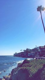 Scenic view of calm sea against clear blue sky