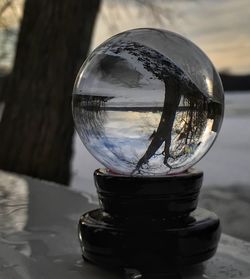 Close-up of crystal ball on table