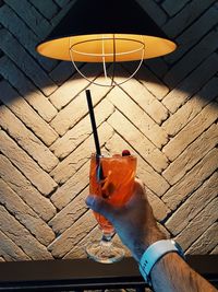 High angle view of person holding drink