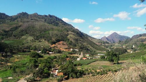 Scenic view of landscape and mountains against sky