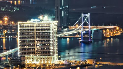 Illuminated modern buildings in city at night