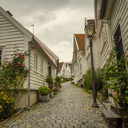 Street amidst buildings against sky