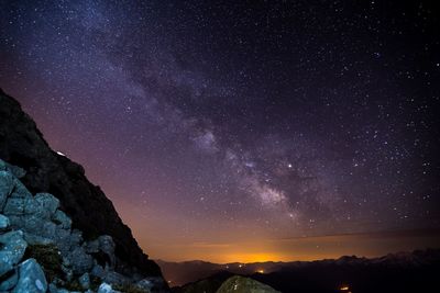 Low angle view of starry sky at night