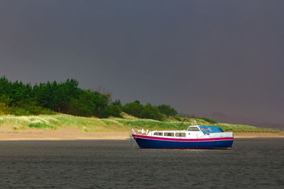 Nautical vessel on sea against sky