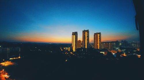 Illuminated cityscape at night