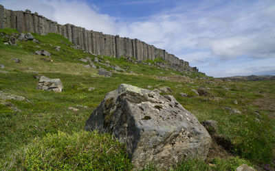 Castle on field against sky