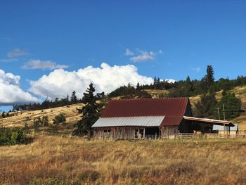 House on field against sky