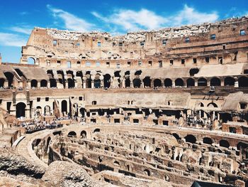 Interior of colosseum against sky