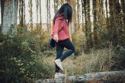 Full length of woman in forest