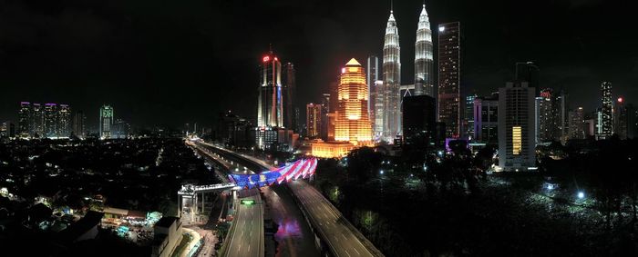 Aerial view of illuminated buildings in city at night