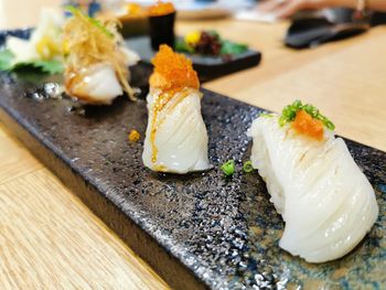 Close-up of sushi served on table