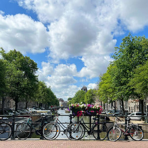 Bicycles on street against sky