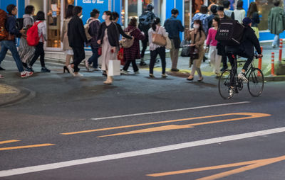 People on road in city