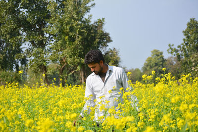 Full length of man standing on field