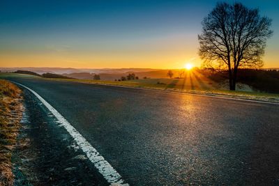 Road against sky during sunset